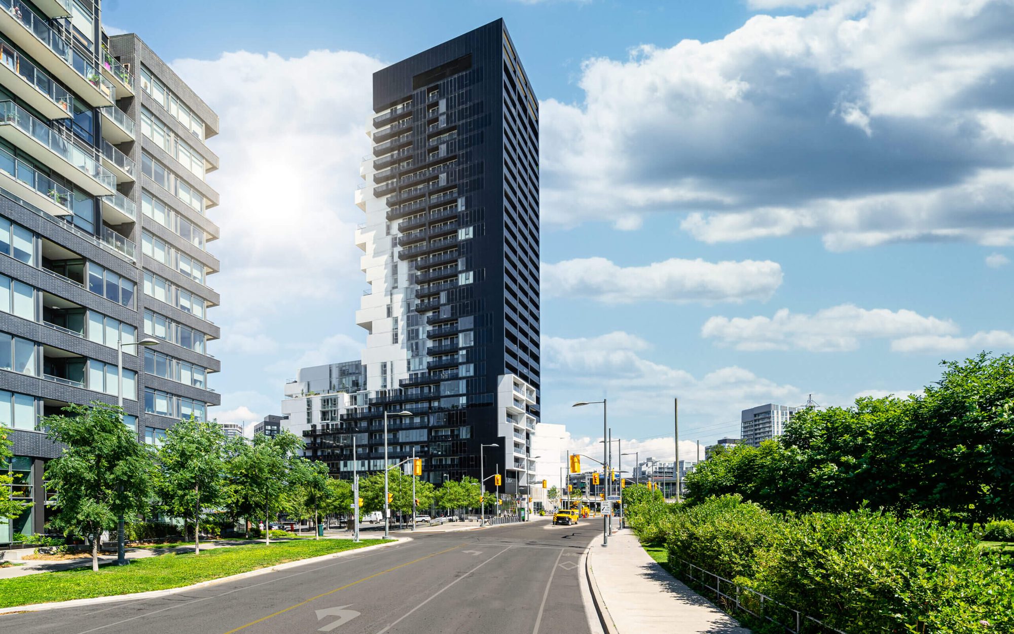 Alpolic Canada — River City Phase 3 Toronto street view, 8,000 ALPOLIC/fr panels in TOB Black and custom white, distributed by Exterior Technologies Group