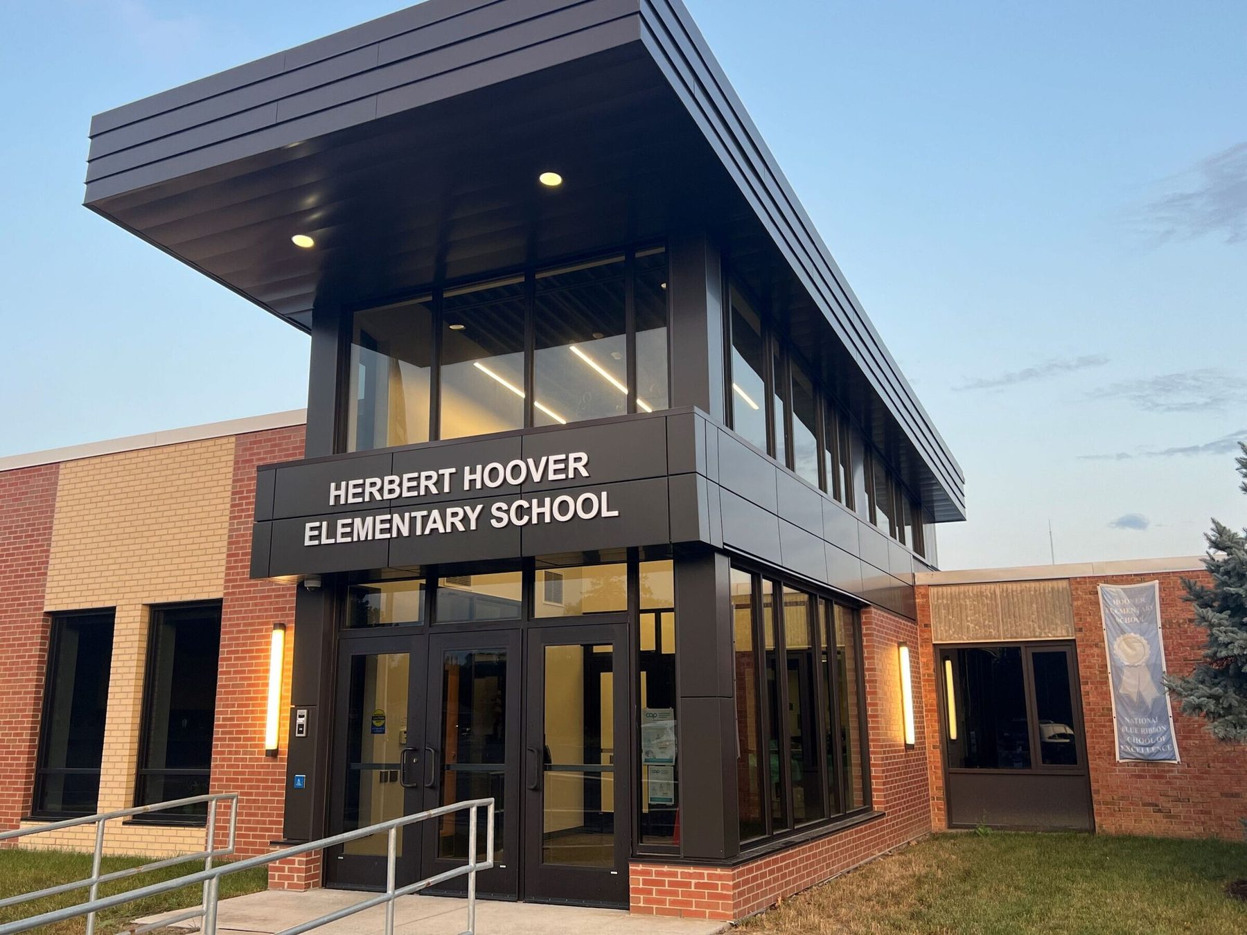 School entrance addition with black Alpolic solid colour series