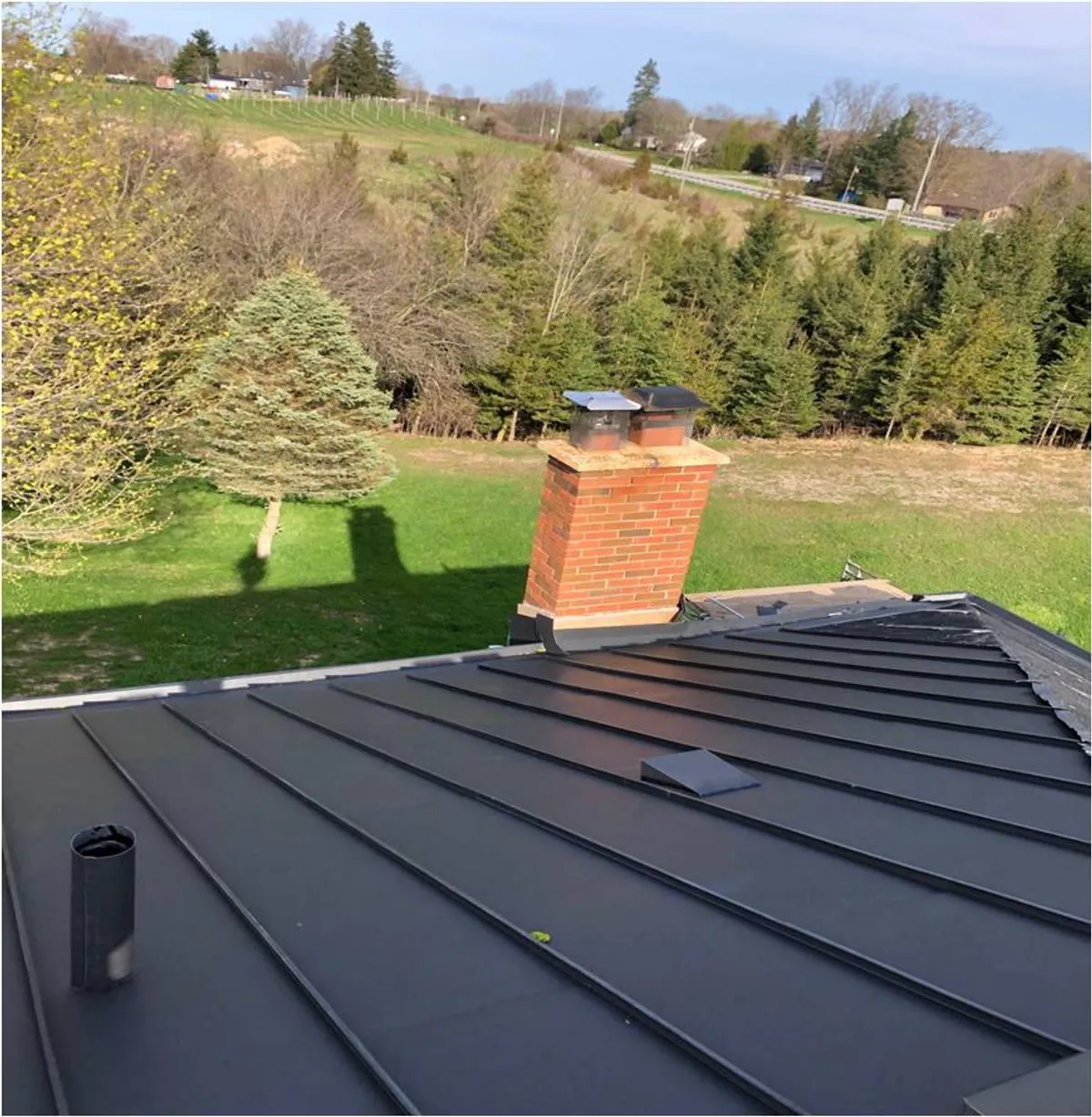 elZinc Canada — Graphite standing-seam zinc residential roof, supplied by Exterior Technologies Group
