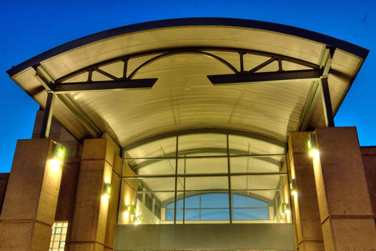 EPIC Metals Canada — Archdeck barrel-vault entrance at dusk, supplied by Exterior Technologies Group