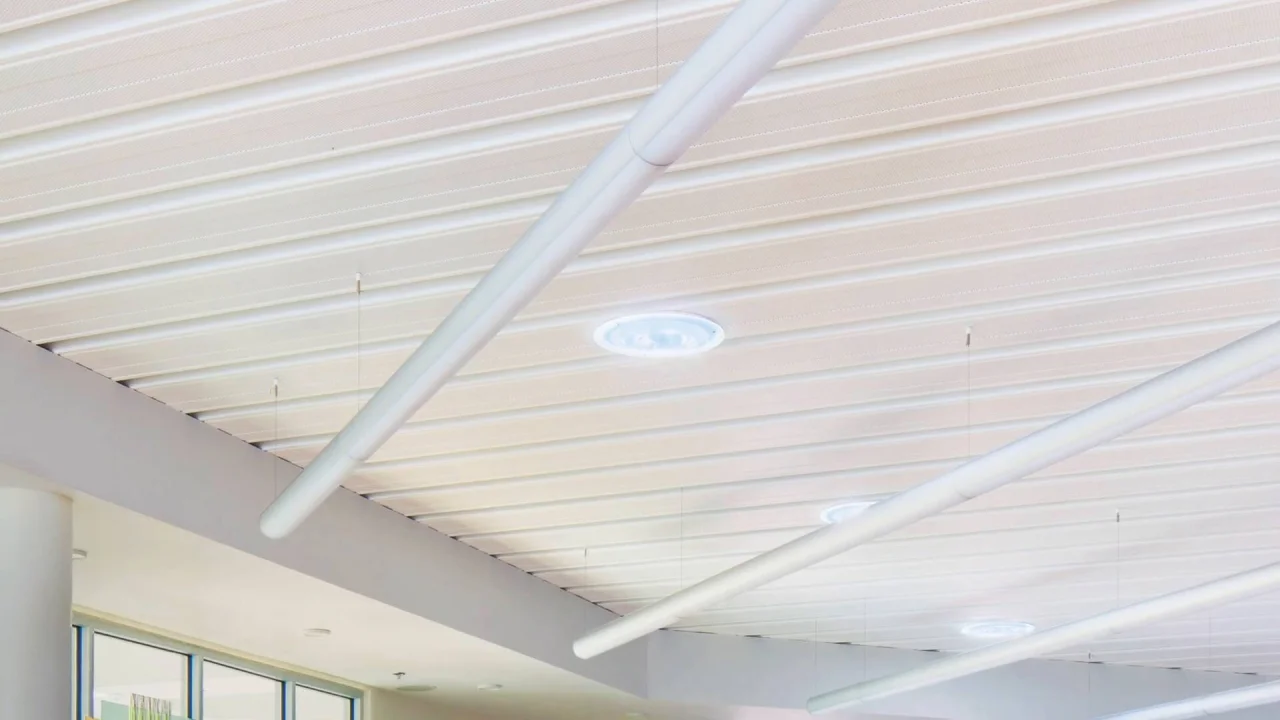 EPIC Metals Canada — linear ribbed soffit detail with integrated HVAC ductwork, by Exterior Technologies Group