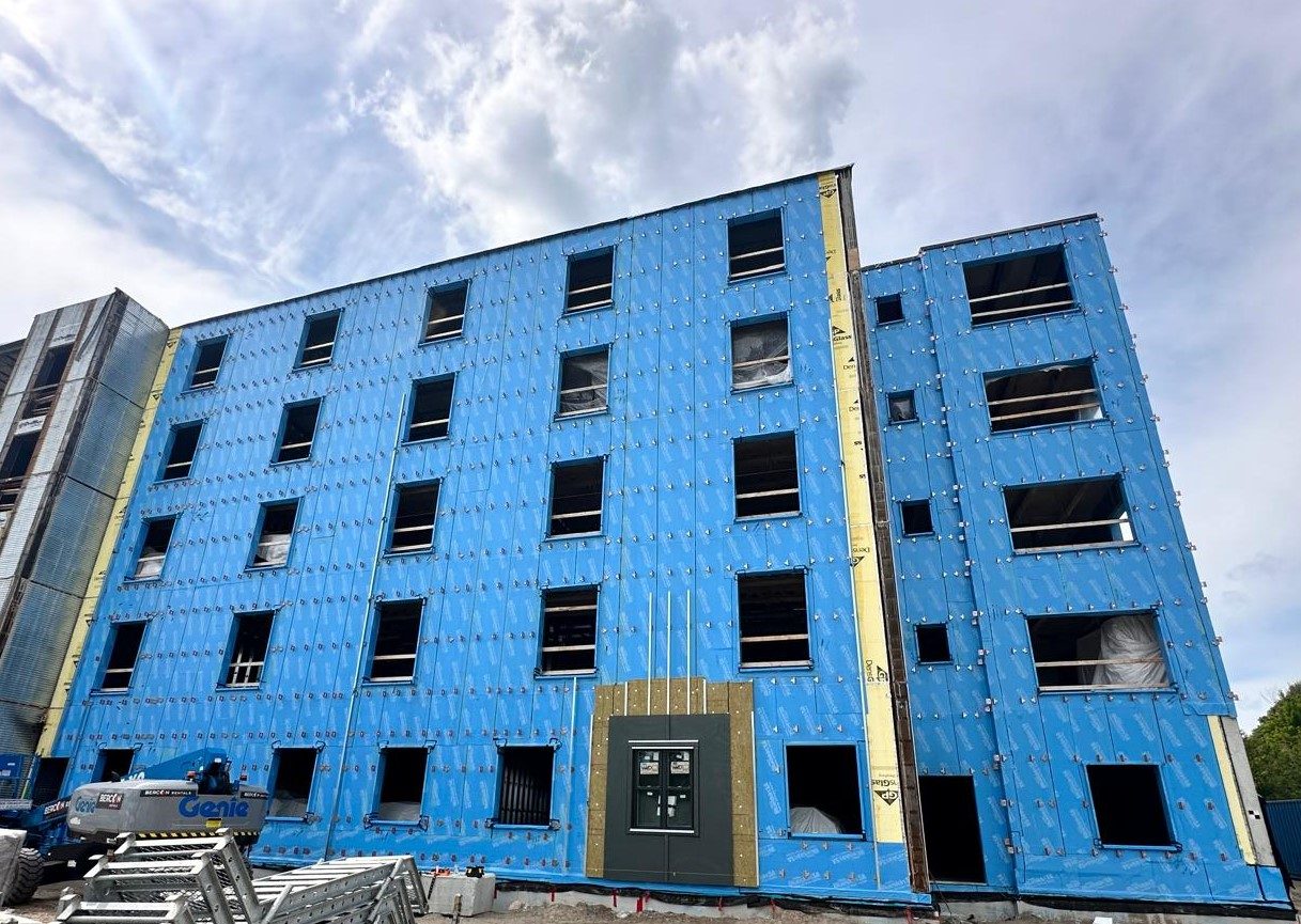 TAC Thermal Spacer Canada — multi-story rainscreen wall under construction with TAC clips installed across full elevation, supplied by Exterior Technologies Group